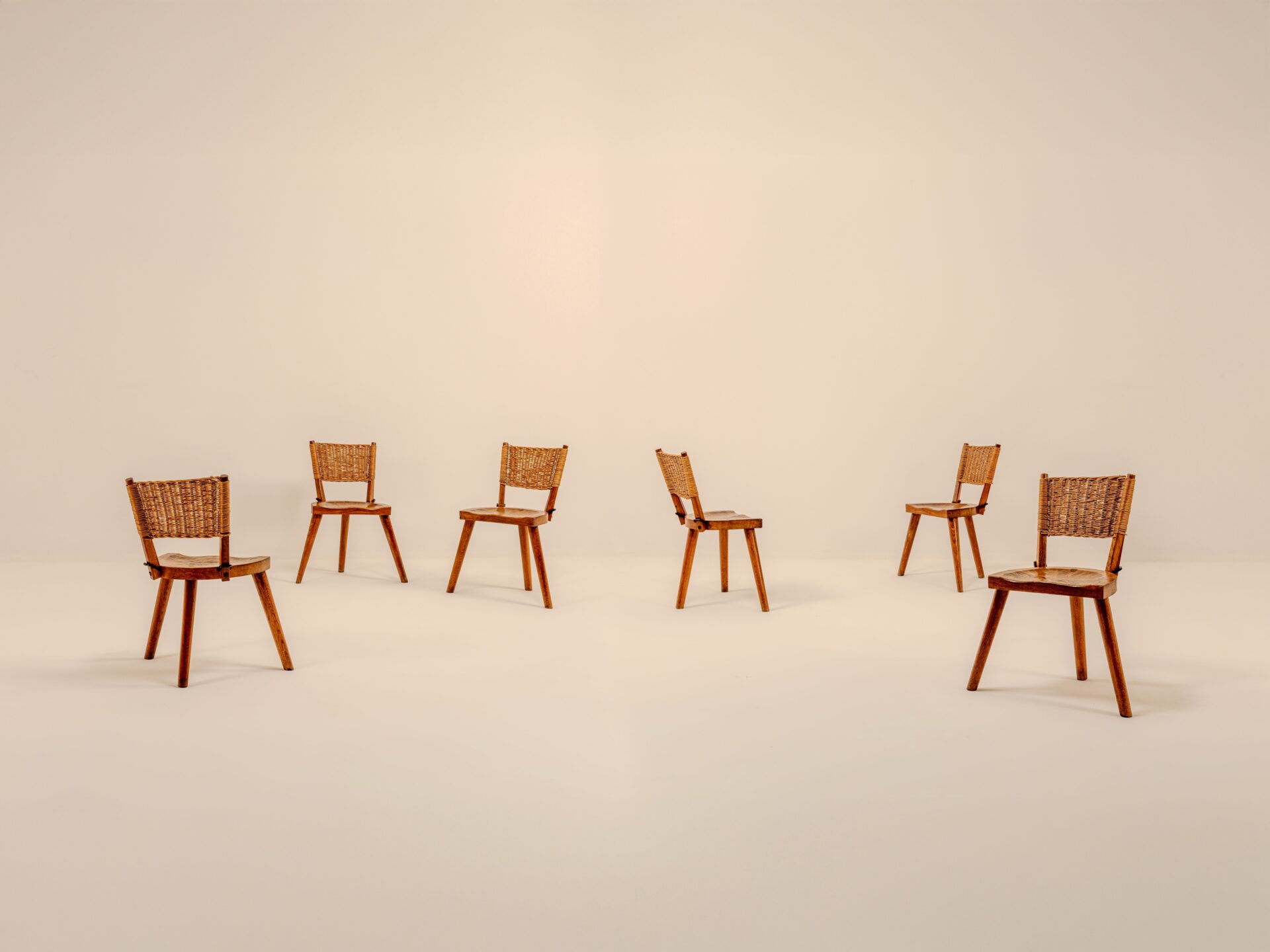 JEAN TOURET & MAROLLES SET OF 6 WICKER CHAIRS