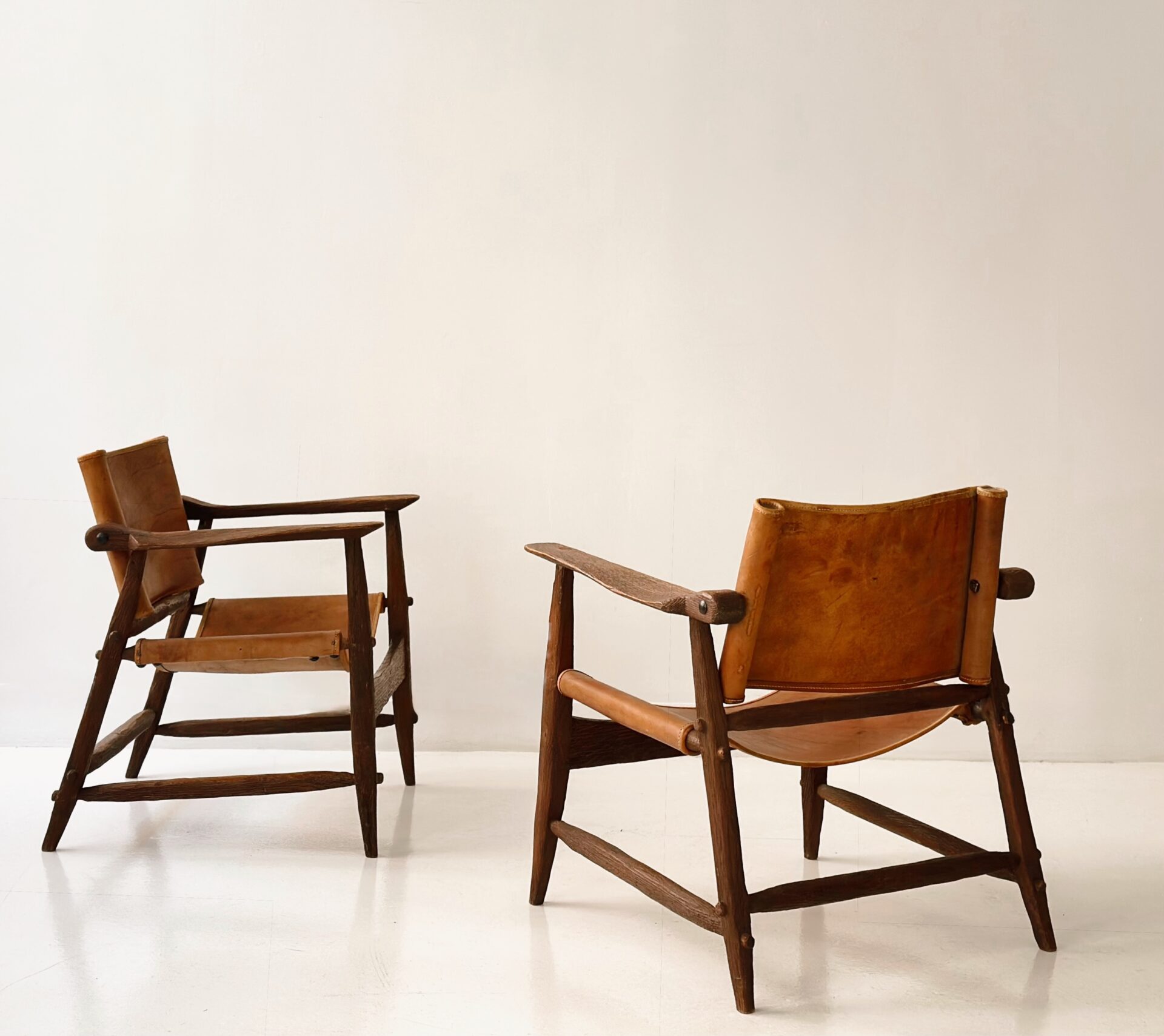 JEAN TOURET & BONNEVAL PAIR OF HUNTING CHAIRS CIRCA 1950