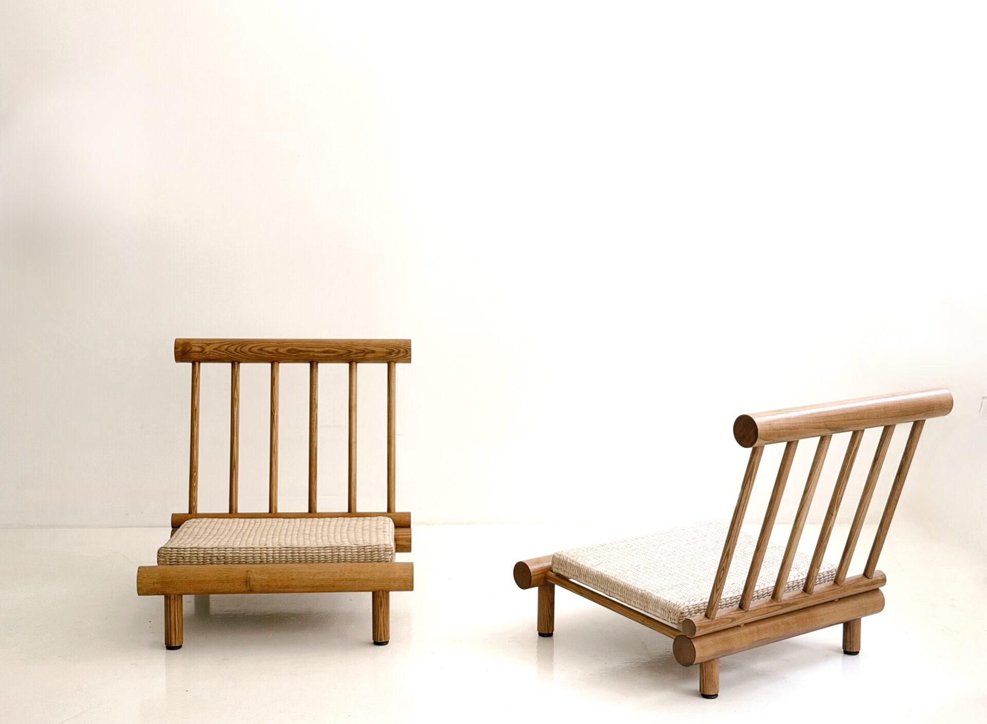 CHARLOTTE PERRIAND "LA CACHETTE" SLIPPER CHAIRS